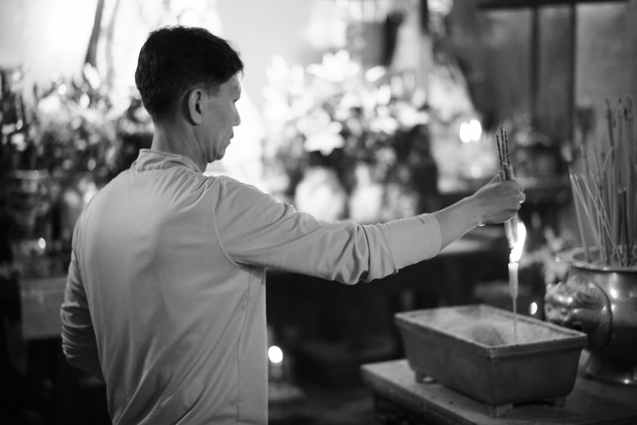 Praying at Man Mo temple, Hong Kong